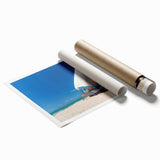 Rolled print of a Brazilian landscape with vibrant green foliage and a distant waterfall.