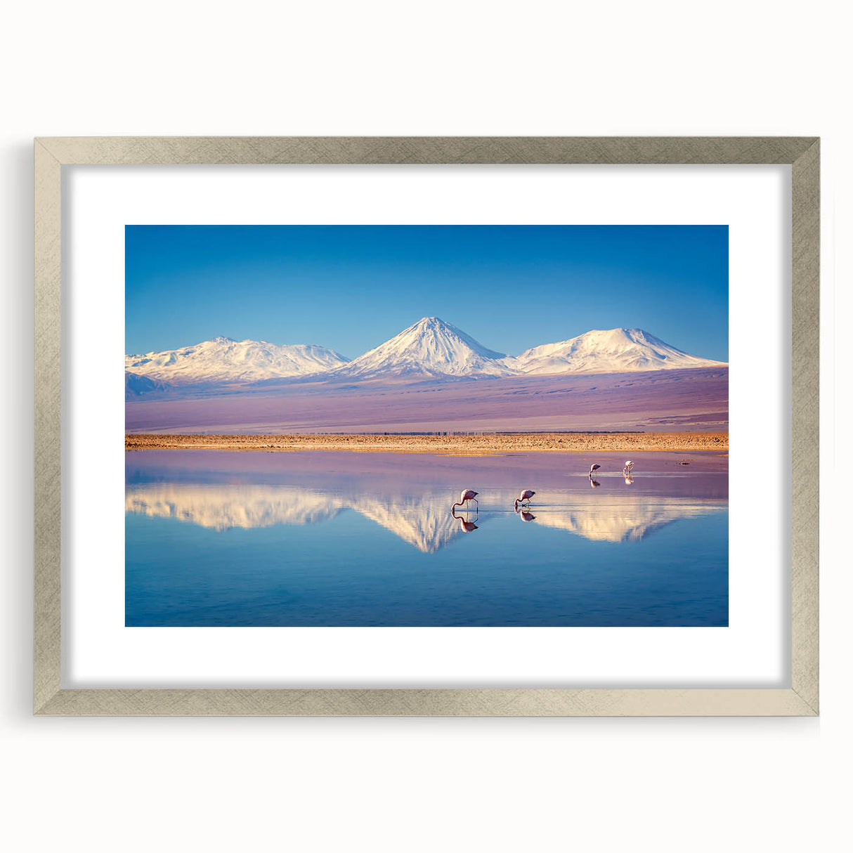 Textured abstract art print of a Chilean landscape in muted earth tones, framed in silver, ideal for bedroom art.