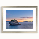 Textured abstract art print of Lake Tahoe in muted blue and gray tones, framed in silver, ideal for bedroom art.