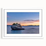 Abstract art print of Lake Tahoe in muted blue and green tones on a framed white mat, ideal for dining room decor.