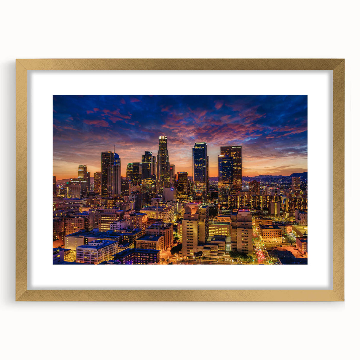 Extra large abstract art print of Los Angeles skyline in muted gold and blue tones on a framed canvas.