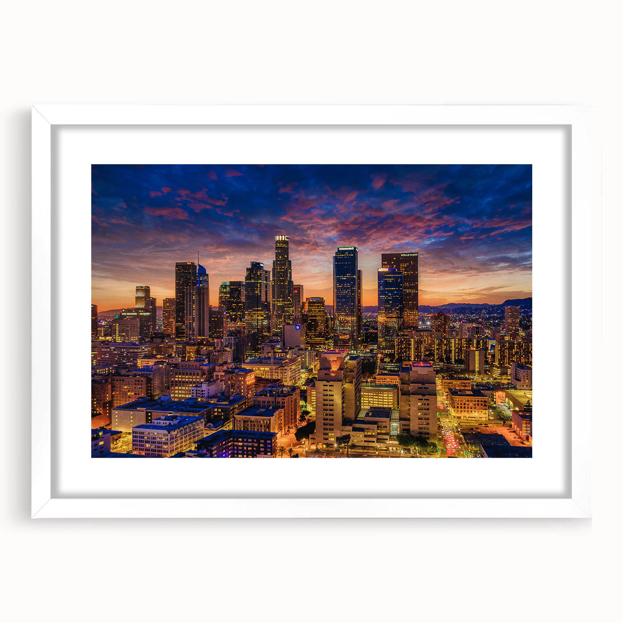 Abstract art print of Los Angeles skyline in muted gray and blue tones on a framed white canvas, ideal for dining room decor.