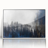 Acrylic print of Vail, Colorado with snowy mountains in muted blues and whites, framed in white.