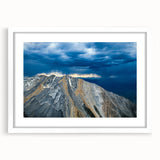 Abstract art print of Idaho scenery in muted green and blue tones, framed with a white mat, suitable for dining room decor.