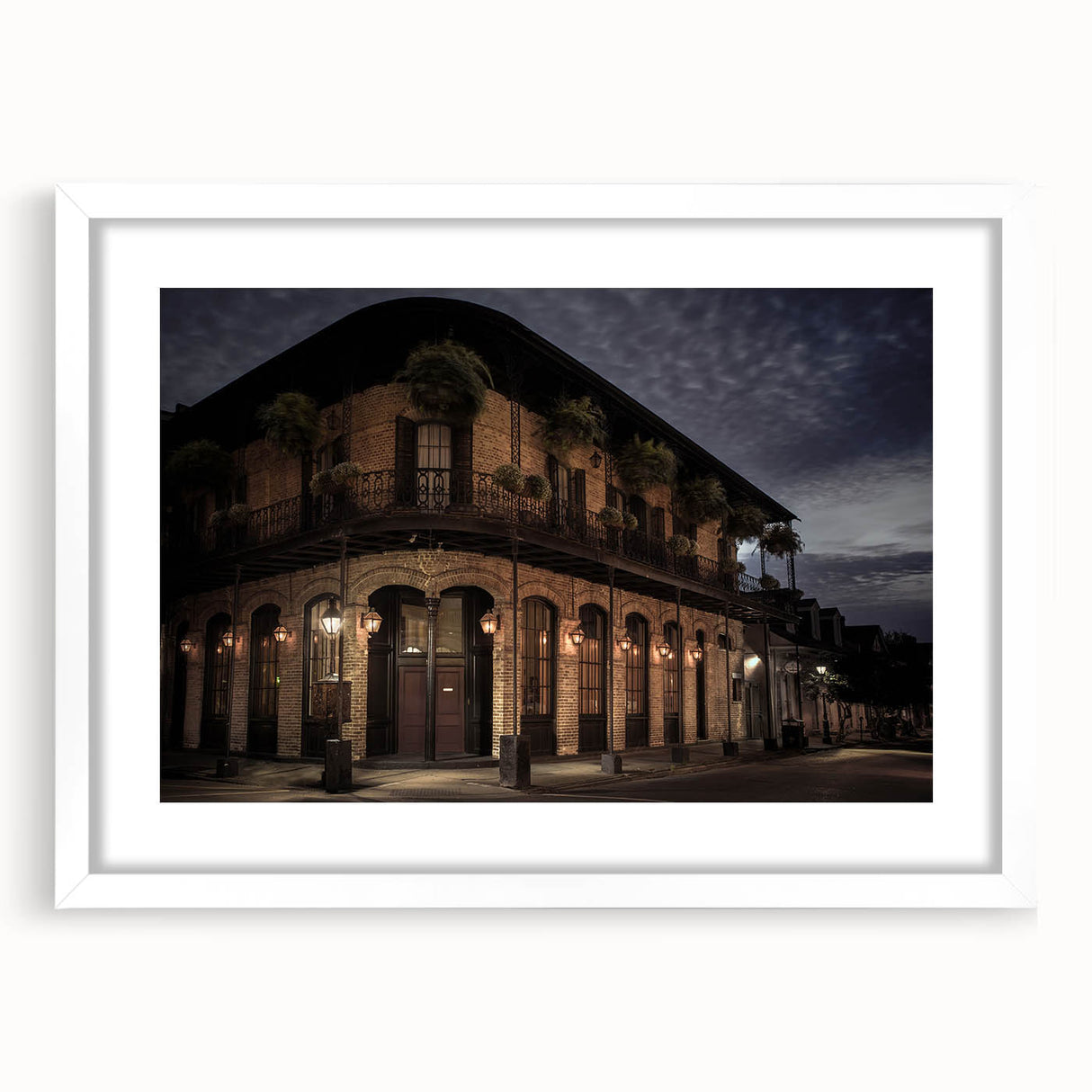 Abstract art print featuring a colorful depiction of the New Orleans skyline on a white framed canvas.