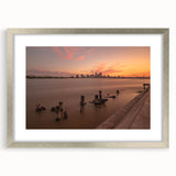 Textured abstract art print of Louisiana scenery in muted green and blue tones, framed in silver, ideal for bedroom art.