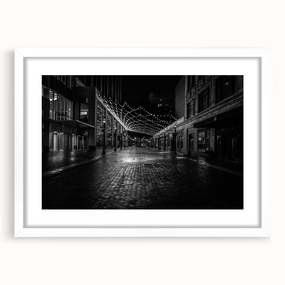 Abstract art print depicting the Detroit skyline in cool blue tones on a framed white mat, ideal for dining room decor.