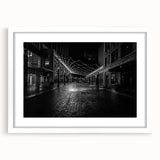 Abstract art print depicting the Detroit skyline in cool blue tones on a framed white mat, ideal for dining room decor.