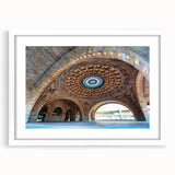 Abstract art print of Pittsburgh skyline in muted gray and blue tones on a framed white mat, suitable for dining room decor.