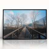 Large abstract wall art depicting a Vermont landscape in muted green and blue tones, framed in black acrylic.