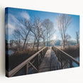 Side view of a large stretched canvas featuring a serene Vermont landscape in muted green and blue tones.