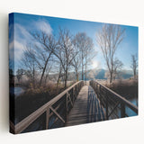 Side view of a large stretched canvas featuring a serene Vermont landscape in muted green and blue tones.