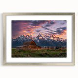 Textured art print of the Grand Tetons in muted earth tones on a framed canvas, suitable for bedroom decor.