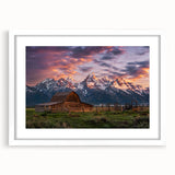 Abstract art print of the Grand Tetons in muted earth tones on a framed white mat, ideal for dining room decor.