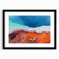 Abstract art print of Yellowstone scenery in vibrant colors on a large framed canvas, ideal for living room decor.