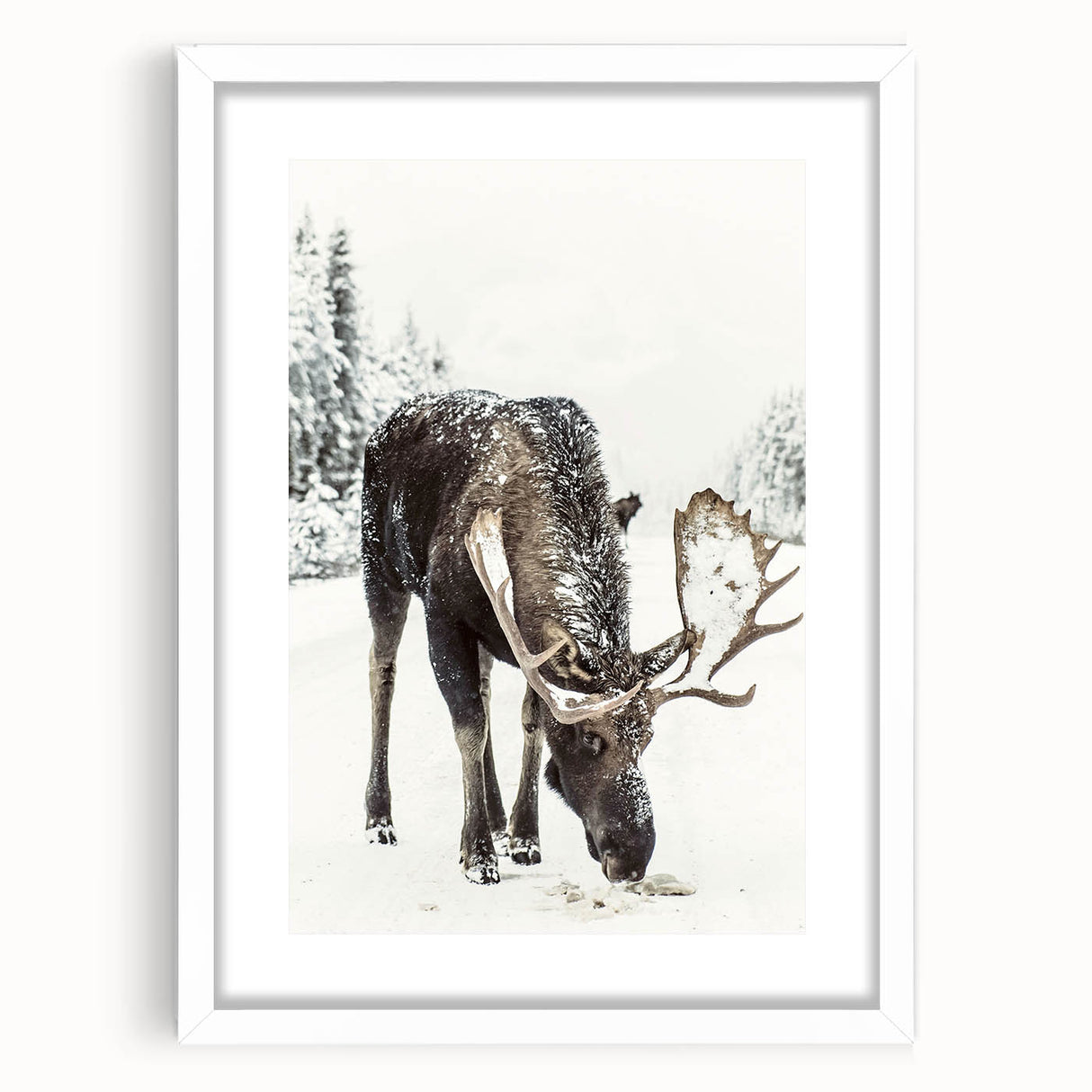 Abstract art print depicting a winter scene in muted blue and white tones on a framed canvas.
