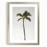 Textured abstract art print in muted gray and blue tones, framed in silver, ideal for modern bedroom ambiance.