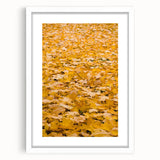 Abstract art print featuring swirling autumnal hues on a white framed canvas, ideal for dining room decor.