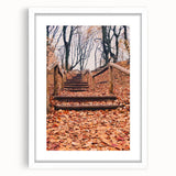 Abstract art print featuring swirling autumnal hues on a white framed canvas, suitable for dining room or bedroom decor.