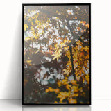 Large abstract wall art featuring warm autumnal hues on a black framed acrylic, ideal for modern living room decor.
