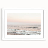 Abstract art print featuring swirling blue and green patterns on a white framed canvas.