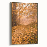 Framed canvas featuring a vintage landscape painting of an autumnal scene with gold and black tones, ideal for bedroom decor.