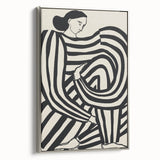 Abstract figurative framed canvas artwork with a silver frame, showcasing dynamic shapes and muted colors, ideal for modern home decor and art enthusiasts.