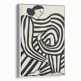 Framed abstract figurative canvas art in a white frame, showcasing vibrant colors and dynamic shapes, perfect for modern home decor and artistic expression.