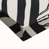 Close-up of an abstract figurative stretched canvas artwork featuring vibrant colors and intricate brush strokes, ideal for modern home decor.