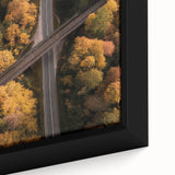 Close-up of a framed landscape canvas depicting a serene bridge scene, featuring lush greenery and vibrant colors, ideal for home decor and nature enthusiasts.