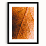 Extra large abstract art print featuring textured fall colors on canvas, framed in black, ideal for living room decor.