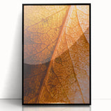 Large abstract wall art depicting fall trees in orange and red tones on black framed acrylic.