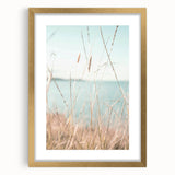 Extra large abstract art print featuring textured swirls in warm orange and yellow tones, framed in gold.