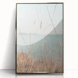 Mid-century modernist art depicting a summer scene with bright yellow and green tones on a silver-framed acrylic print.