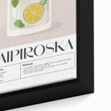 Close-up of black wall art featuring colorful, textured food and drink motifs on a framed canvas.