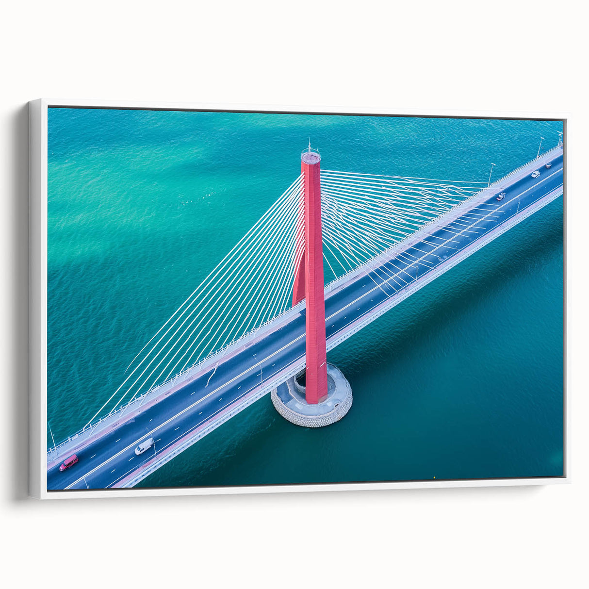 Framed canvas artwork depicting a serene landscape bridge scene, featuring vibrant colors and intricate details, perfect for enhancing home decor. The piece showcases a white frame, adding elegance to any setting.