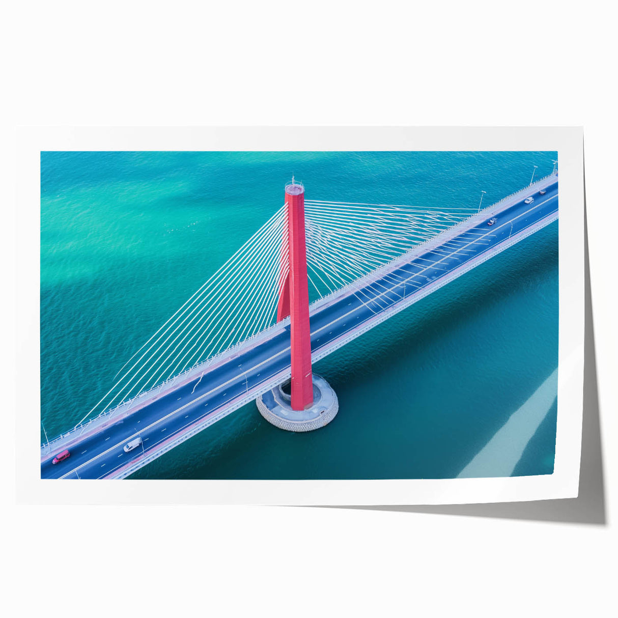 Landscape bridge rolled print showcasing a serene natural scene with vibrant colors, packaged securely in a sturdy cardboard tube for easy transport and display.