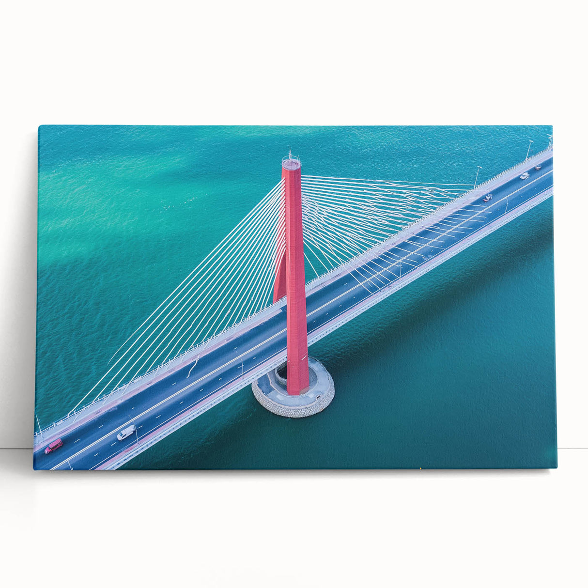 Stretched canvas artwork depicting a serene landscape bridge over a tranquil river, with vibrant greenery and a clear blue sky, ideal for home decor or nature enthusiasts.