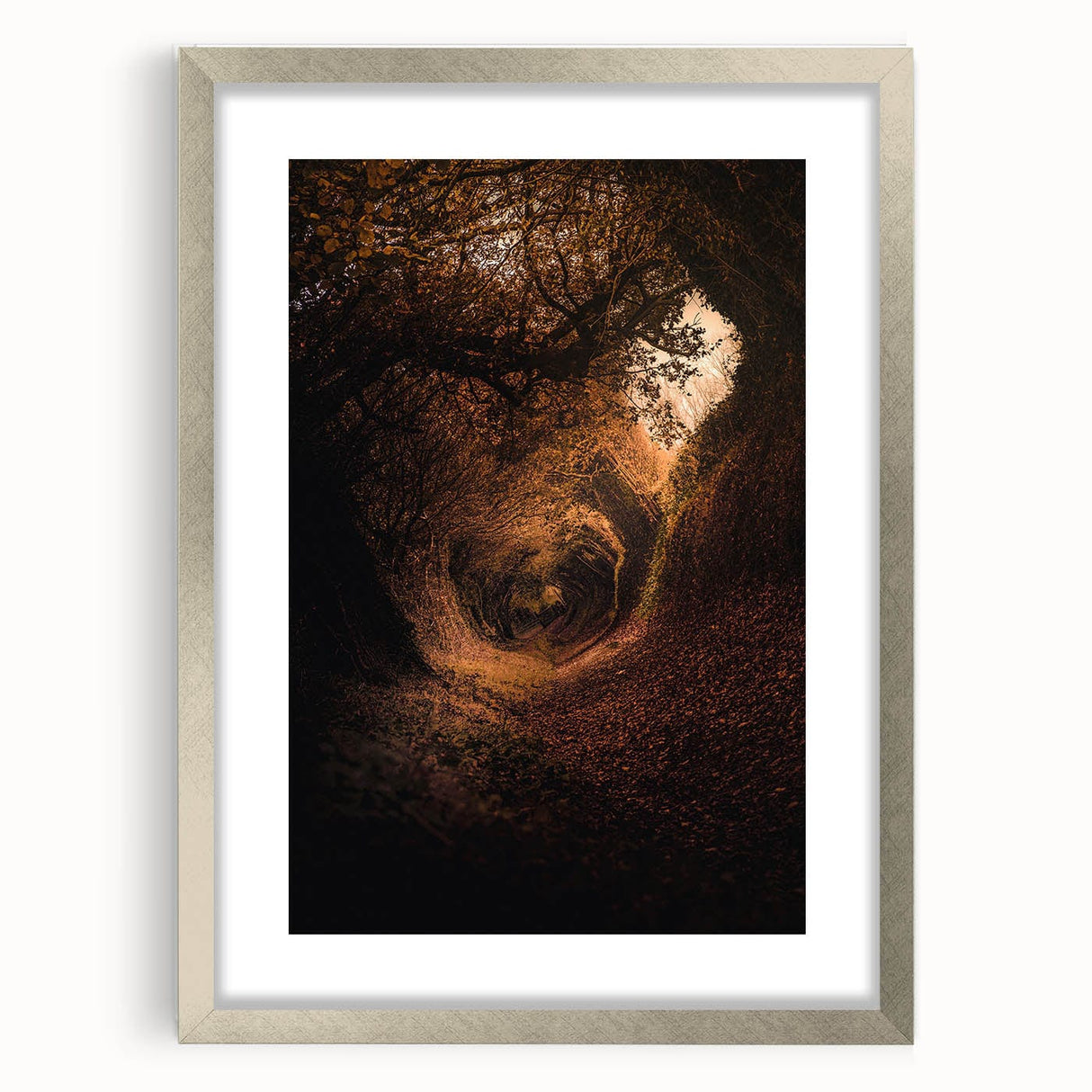 Textured art depicting abstract fall scenery in muted orange and brown tones on a framed silver canvas.