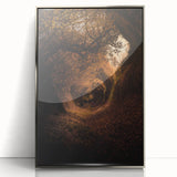 Large art print of a mid-century modernist autumn scene in muted orange and brown tones, framed in silver acrylic.
