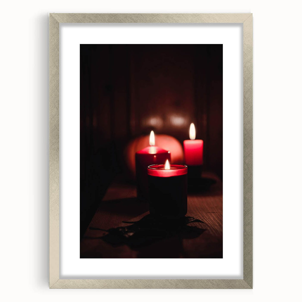 Textured art print featuring abstract layers in warm autumnal hues on a silver-framed canvas, suitable for bedroom decor.