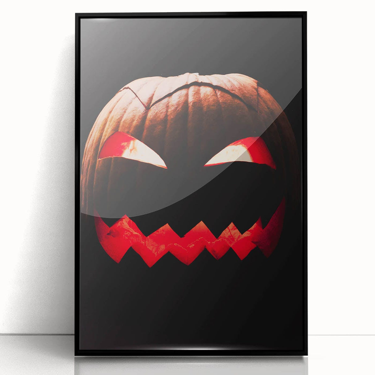 Large abstract wall art depicting autumnal trees in bold orange and red on a black framed acrylic print.
