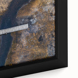 Close-up of a framed landscape canvas artwork depicting a serene bridge scene with vibrant colors, perfect for home or office decor, showcasing natural beauty and artistic detail.