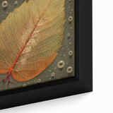 Close-up of a framed canvas wall art featuring vibrant flowers and botanical leaves, showcasing intricate details and rich colors, perfect for home decor.