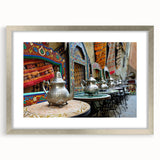 Abstract art print of a Moroccan landscape in muted earth tones on a framed canvas, suitable for dining room decor.