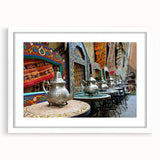 Extra large wall art featuring abstract depiction of Moroccan scenery in textured earth tones, framed with a white mat.