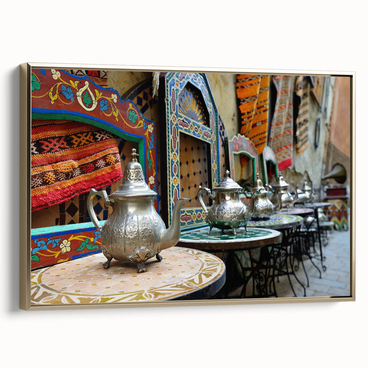 Framed canvas featuring a vintage-style Moroccan landscape with vibrant colors on a black background.