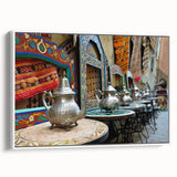 Framed canvas featuring a vintage-style landscape painting of a Moroccan scene in black and white.