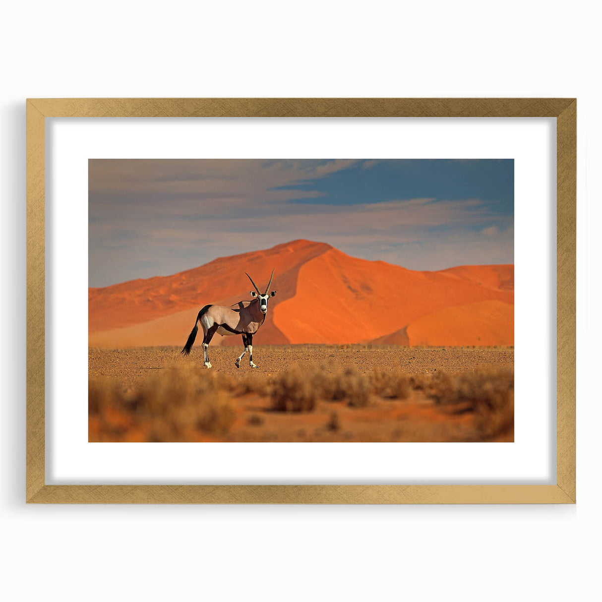 Textured abstract art print depicting a serene African landscape in muted earth tones, framed in gold, ideal for bedroom art.
