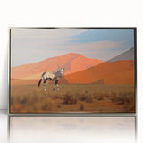 Art deco poster depicting a serene Namibian landscape in soft earth tones, framed in silver acrylic.